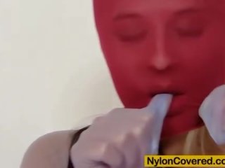 Extraordinary blonde red spandex mask on her face
