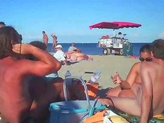 Milf Blows Her companion On Nude Beach By Voyeurs