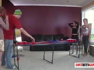 Three Girls and One boy Play a Game of Strip Beer Pong