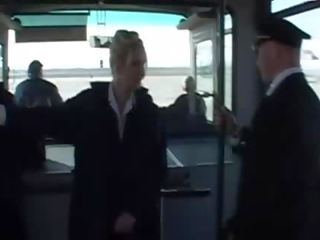 Attractive stewardess stroking hard penis till cumshot